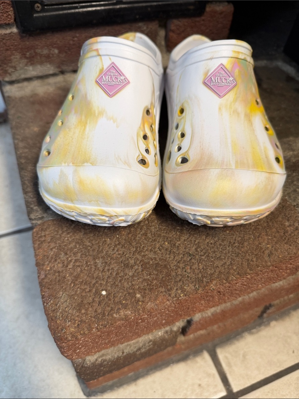 Woman’s multicolored Muck clogs